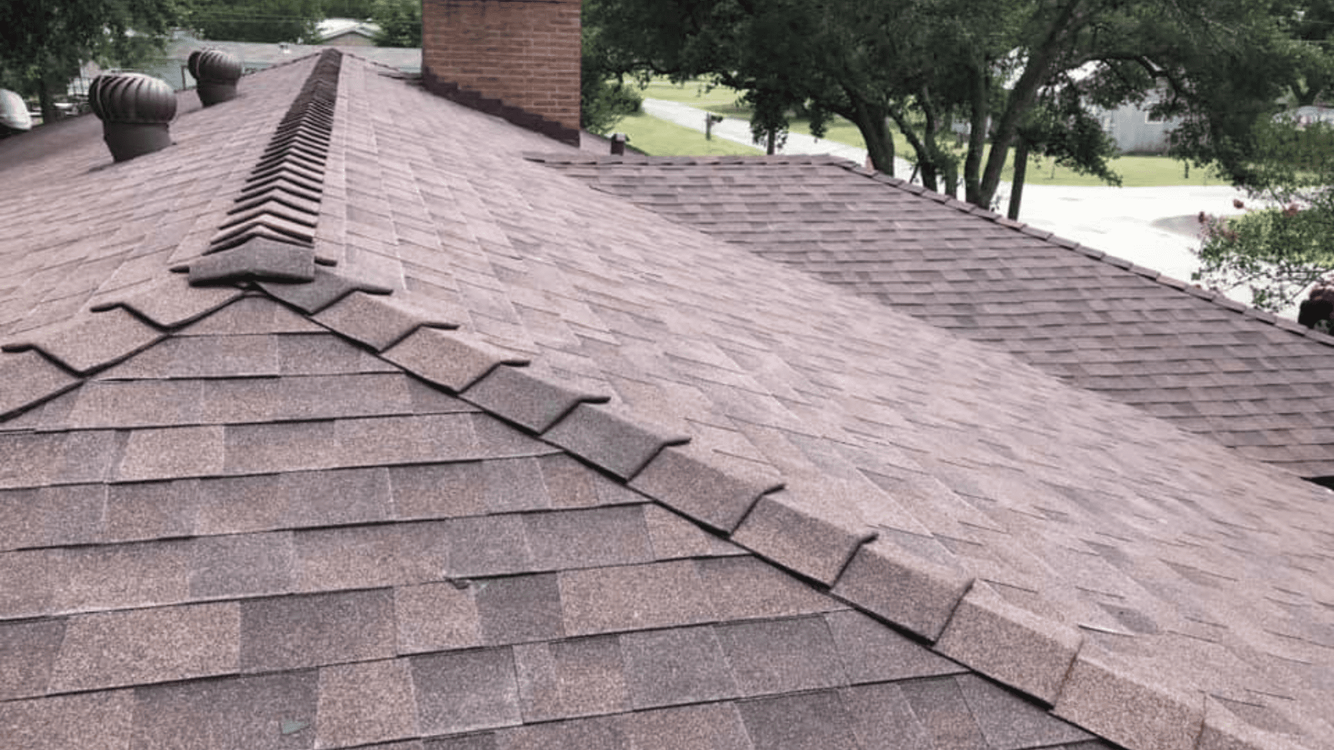 Shingle roof ridges, valleys and chimmey flashing from College Station roof.