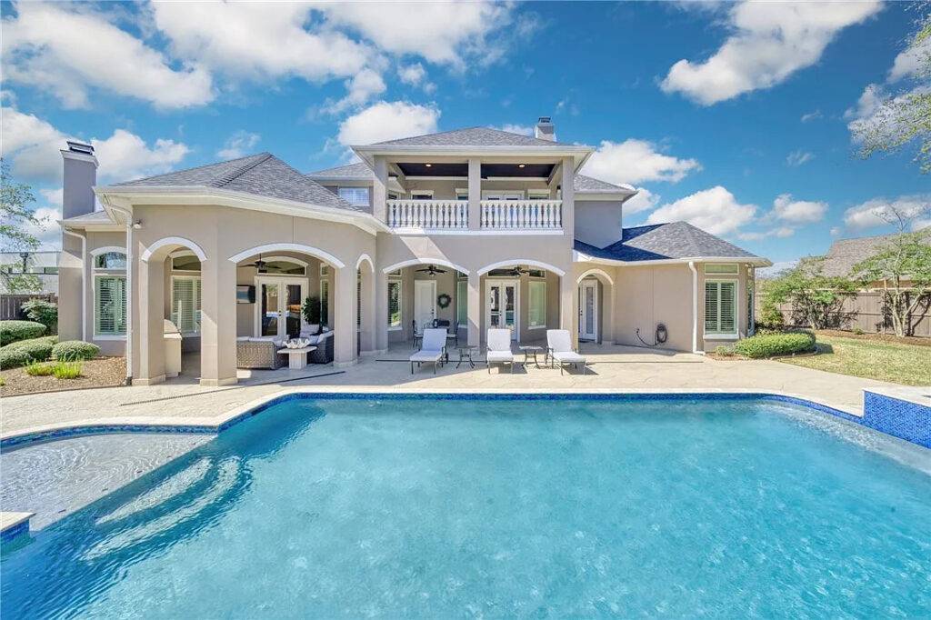 Miramont home with large roof, yard, and pool.